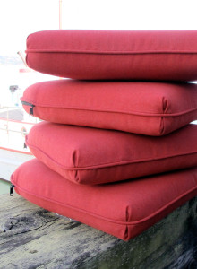 stack of bright red chair cushions
