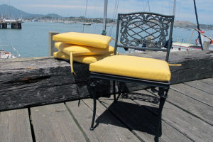 bright yellow seat cushions on black metal chair