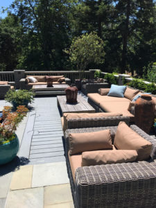 large patio set with custom beige cushions and accent pillows