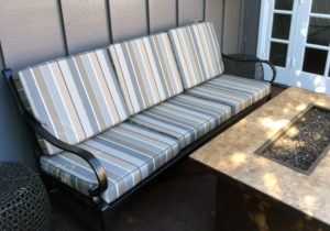 metal bench with seat and back cushion in matching strip