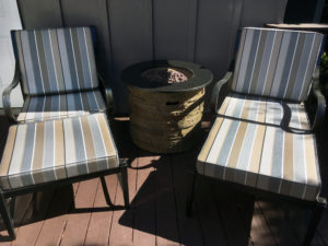 metal chaise with striped hinged cushions