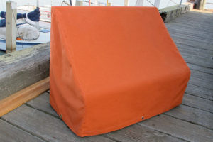 orange sunbrella wicker bench cover