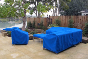 patio set with blue sunbrella protective covers