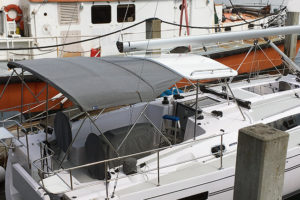 Hardtop for sailboat with stainless steel stanchions and bimini extension
